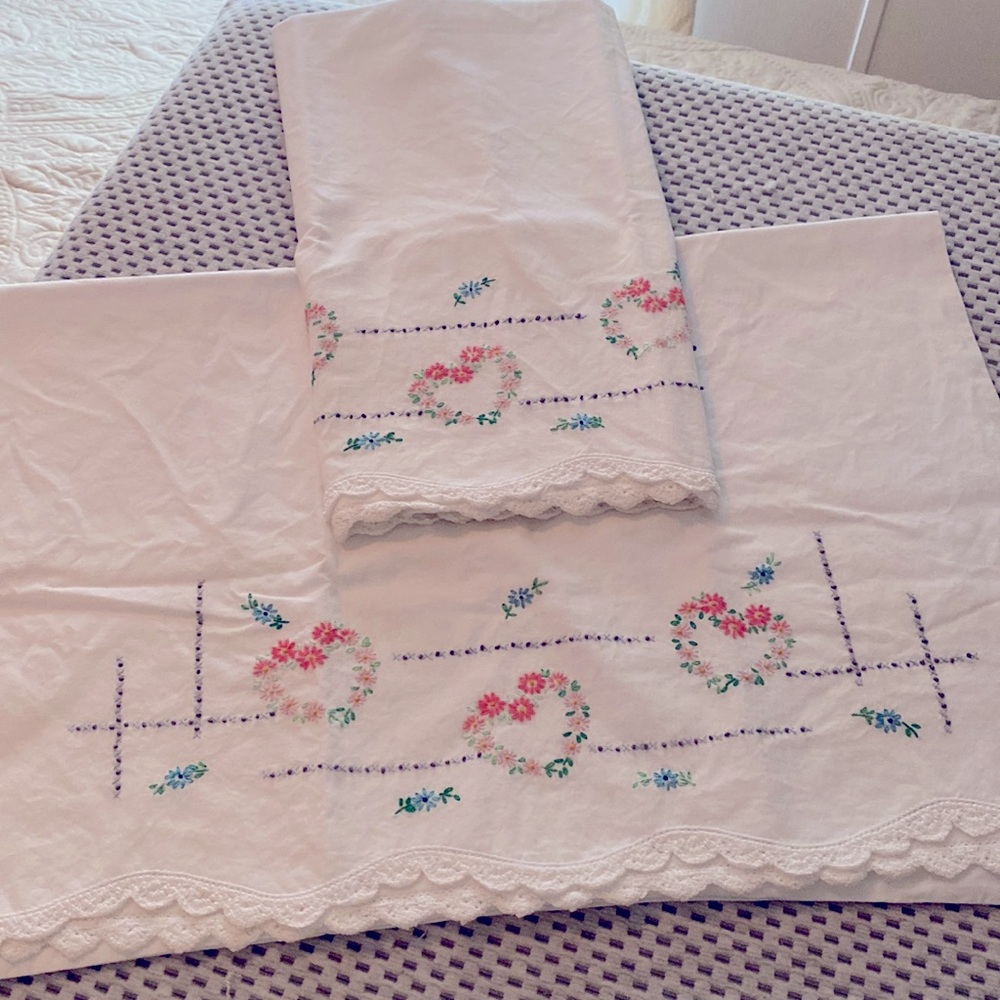 2 off while vintage pillow cases with embroidery are lace. 28”x21”. Regular size
